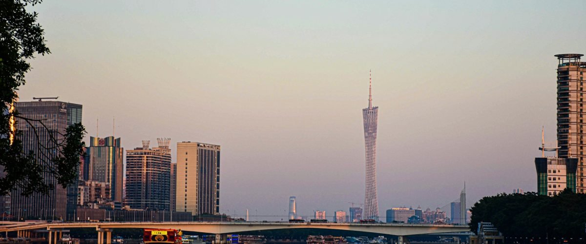 Canton Tower and the Guangzhou skyline across the river at dusk