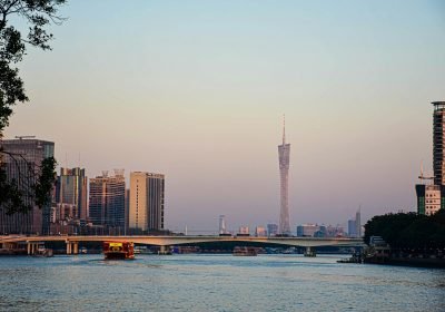 Canton Tower and the Guangzhou skyline across the river at dusk