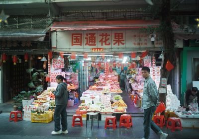 Busy fruit and flower stall at a market in Guangzhou
