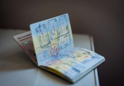 Open passport with multiple travel stamps