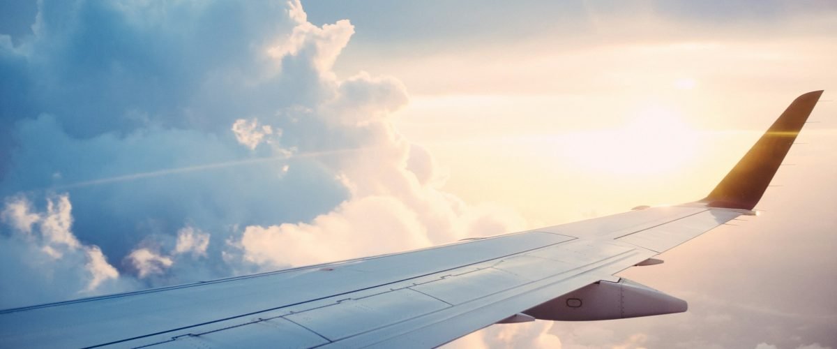 Airplane wing above the clouds